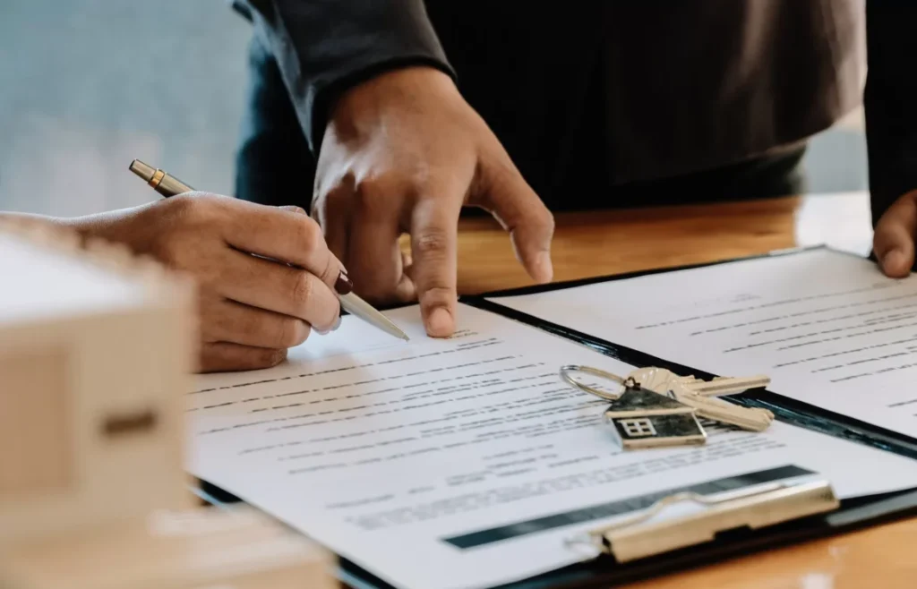 Real estate agent offer hand for customer sign agreement scaled 1 1170x752 1